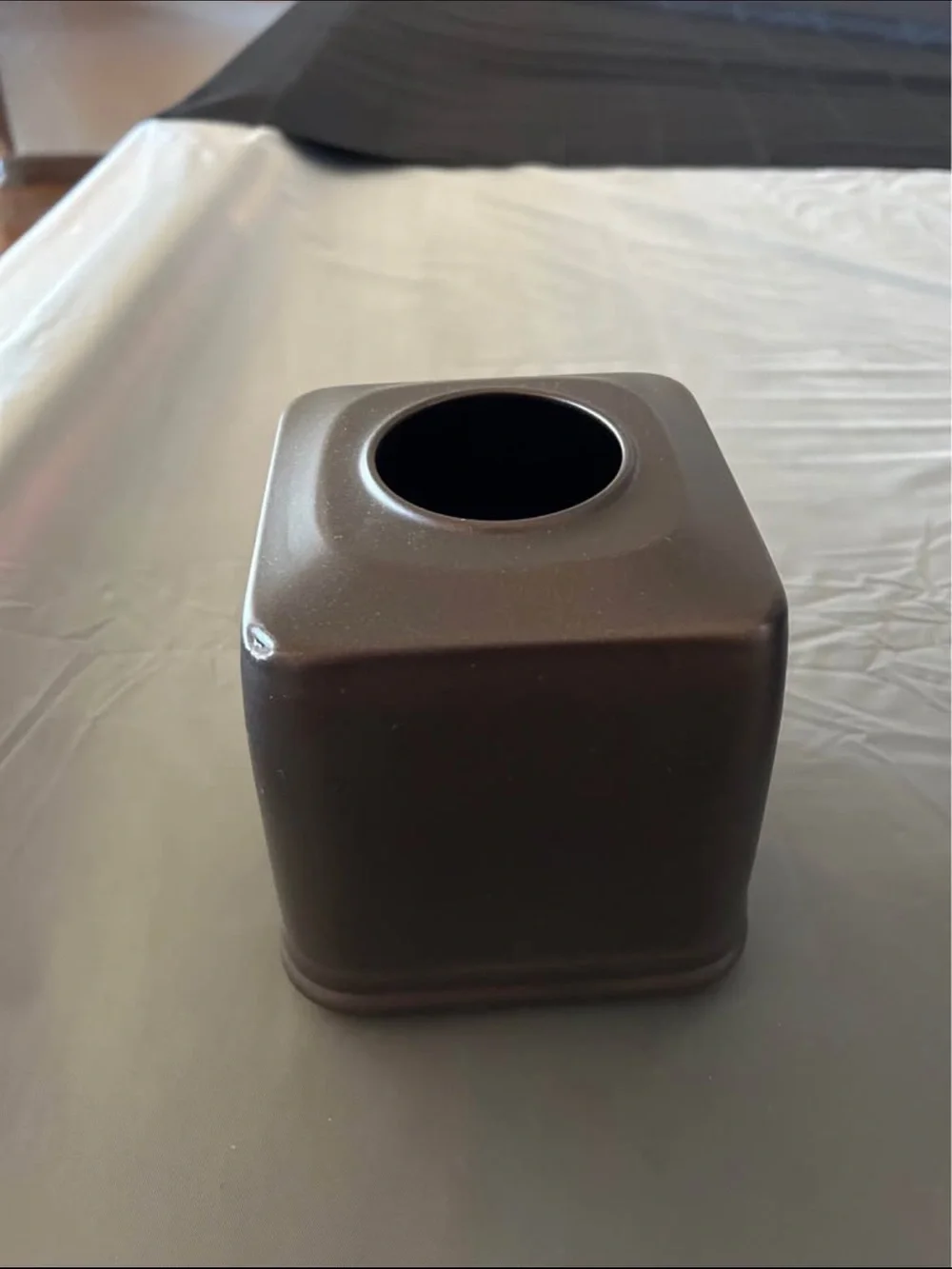 Restoration Hardware toilet paper holder with other accessories.